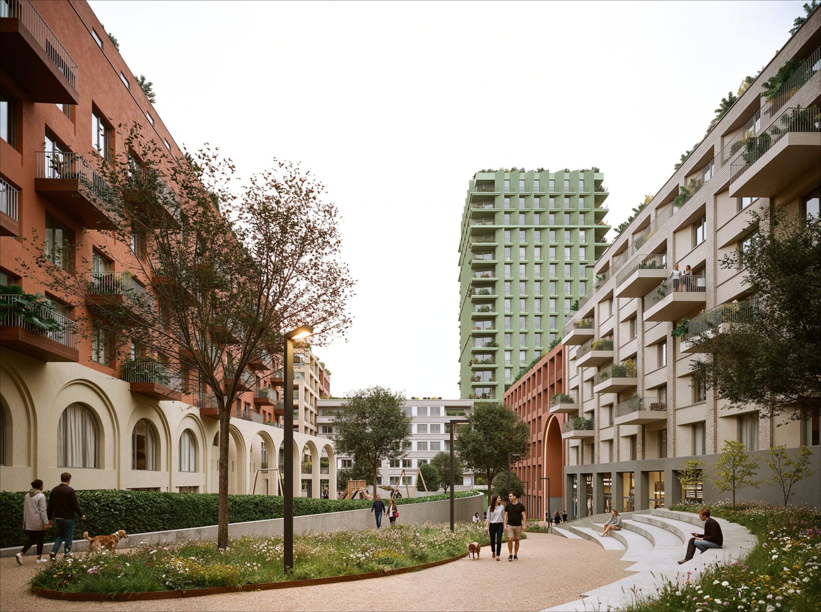 Nárožní budova bloku Nové Dvory v terakotových tónech s věží v pozadí, návrh od architektů z MA Studia