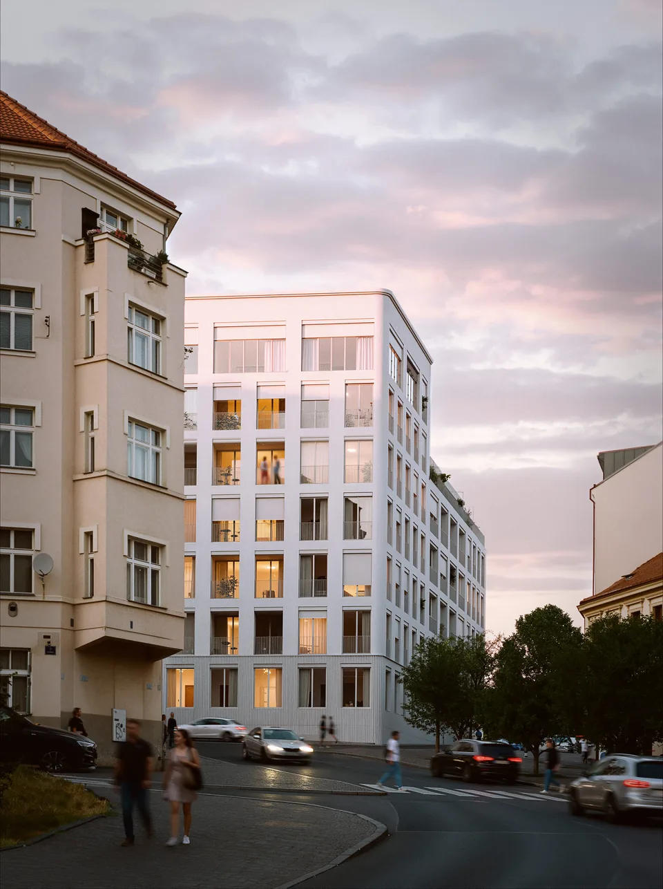 Bytový dům Primátorská mezi stávající zástavbou Horní Libně za soumraku, návrh od architektů z MA Studia